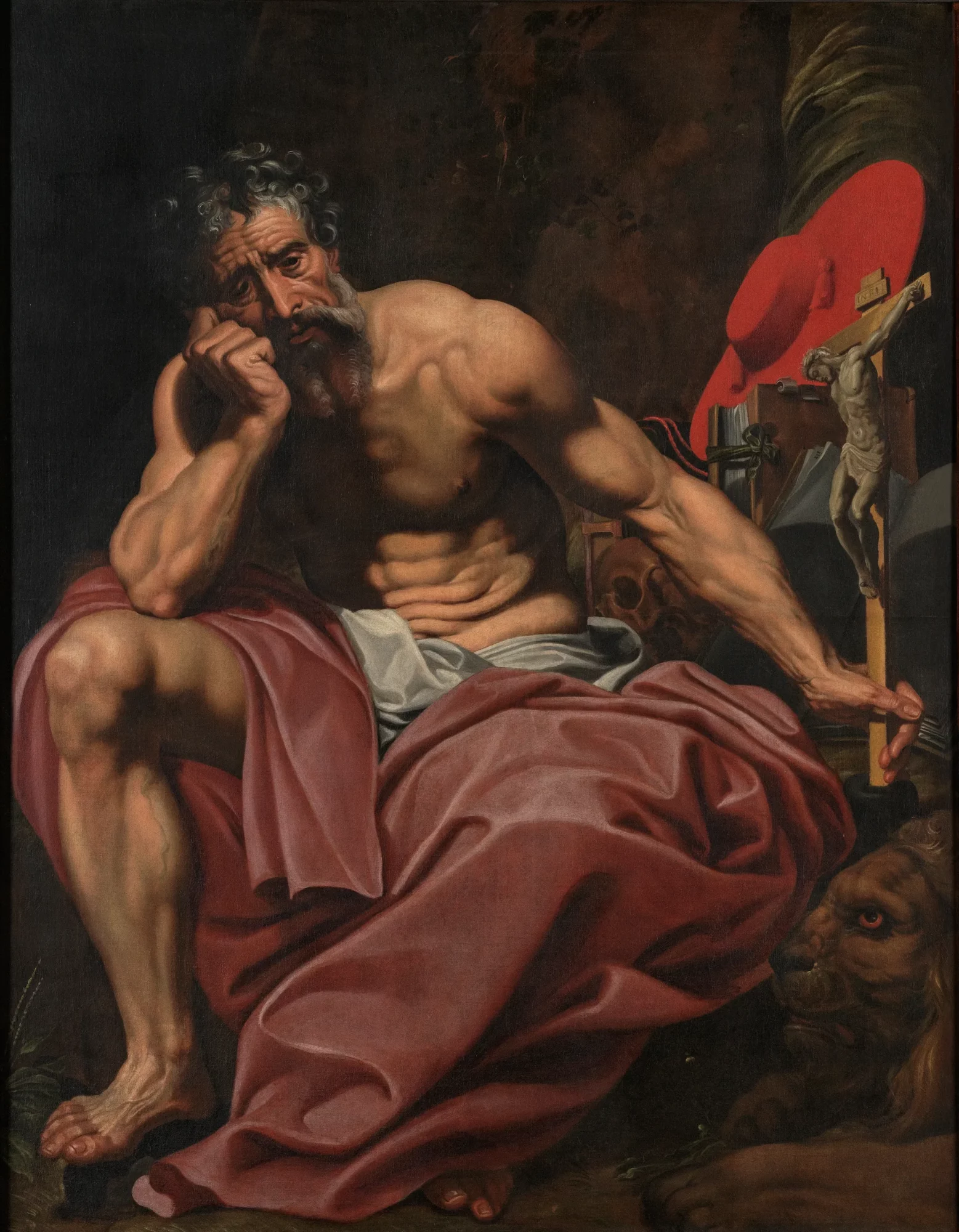 Painting of Saint Jerome depicted as a penitent, seated in a dark interior with a bare torso and a contemplative expression. He holds a crucifix in one hand, while his traditional attribute, the lion, appears beside him.