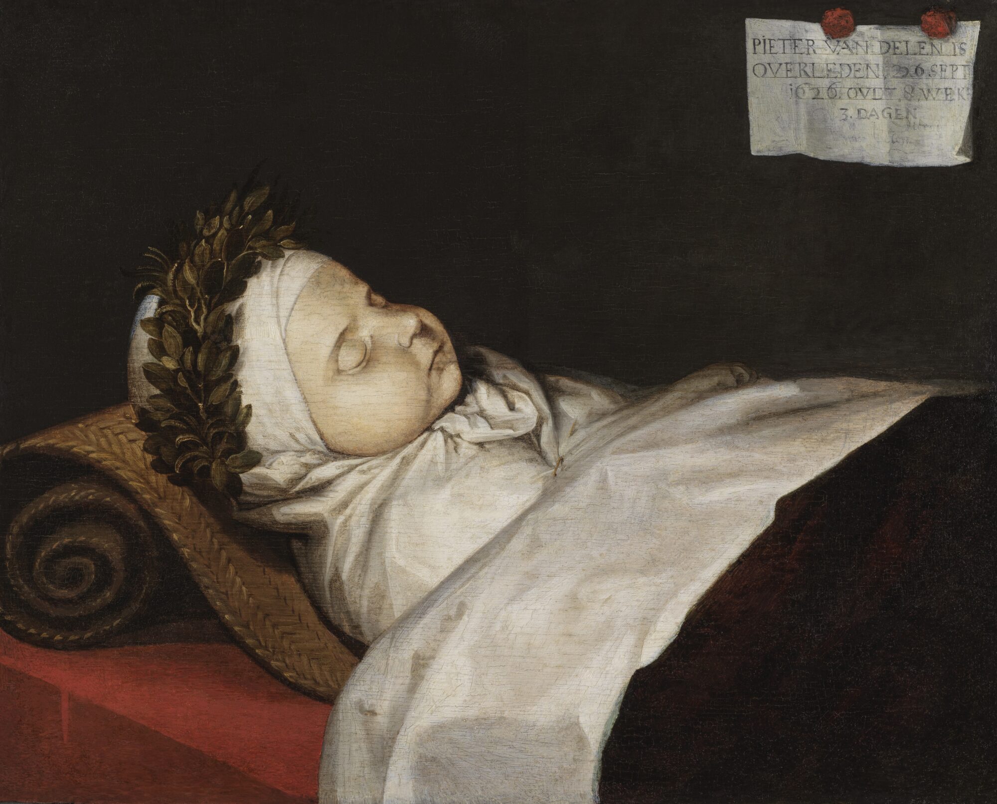Doodsportret van Pieter van Delen door Dirck van Delen (1626), met het overleden kind liggend op een opgerold weefsel, gehuld in wit linnen en met een lauwerkrans rond het hoofd.